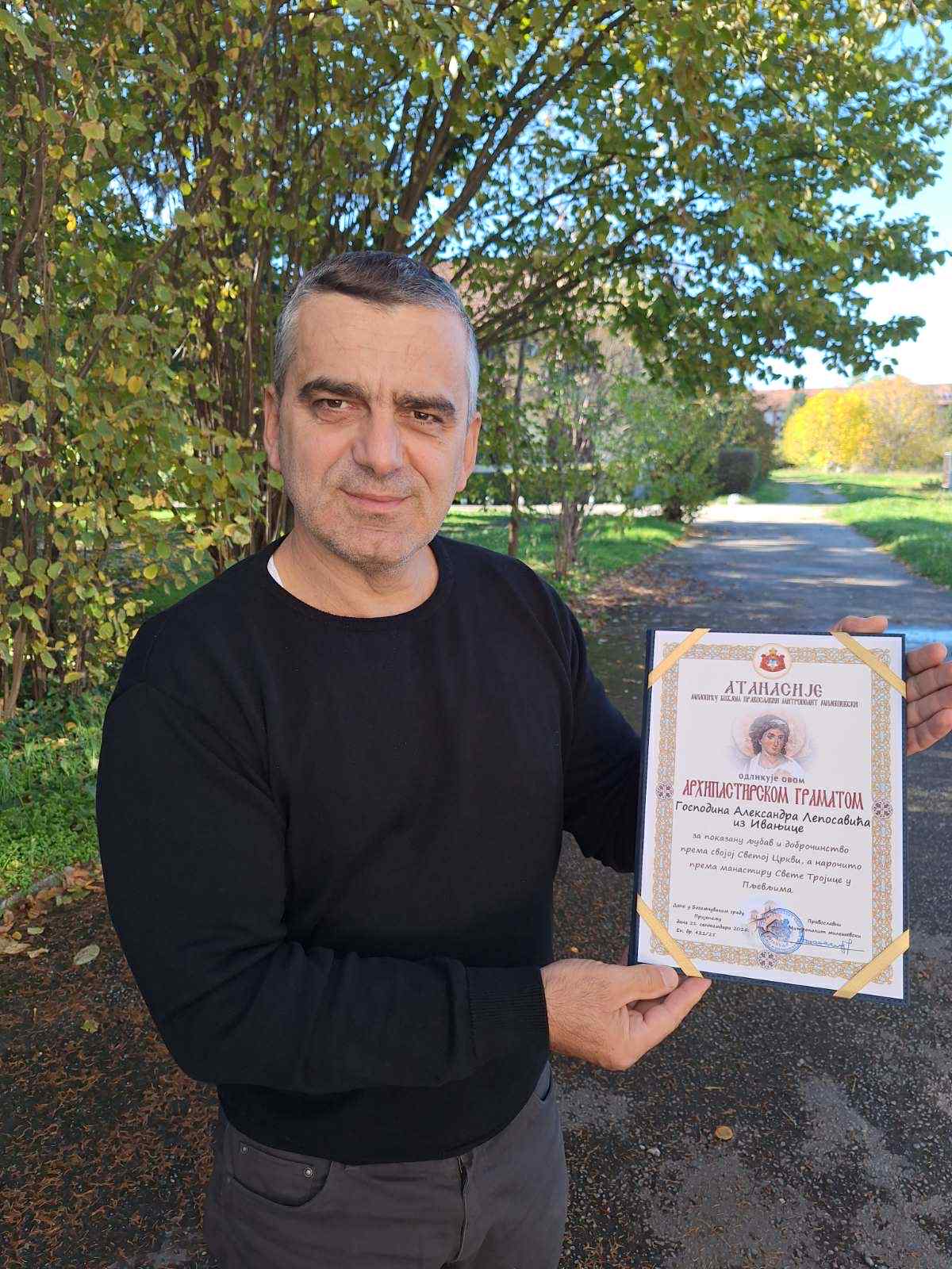 49c91d2d-c017-419b-9372-f827896279ce Pravoslavni mitropolit mileševski Atanasije dodelio arhipastirsku gramatu Aleksandru Leposaviću iz Ivanjice